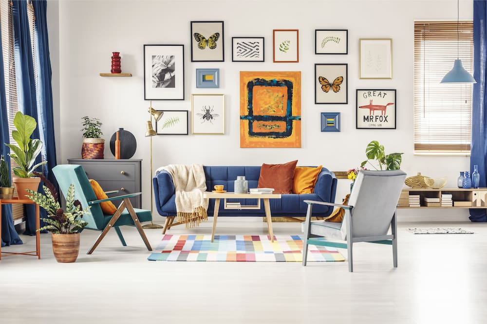 colorful living room with clutter on the table and wall