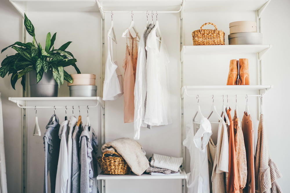 closet with multiple hanging rods and clothing: a good thing to organize